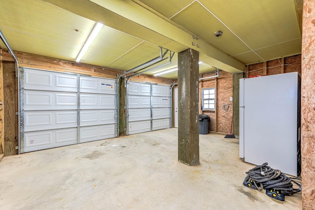 garage with freestanding refrigerator