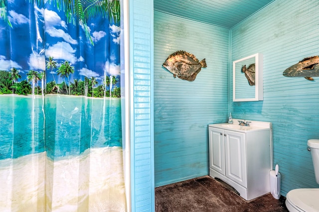 bathroom with toilet and vanity