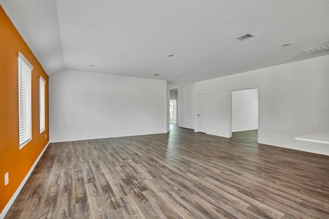 3148 Catalonion Ct, Conroe, TX 77301 - spare room featuring wood finished floors and vaulted ceiling