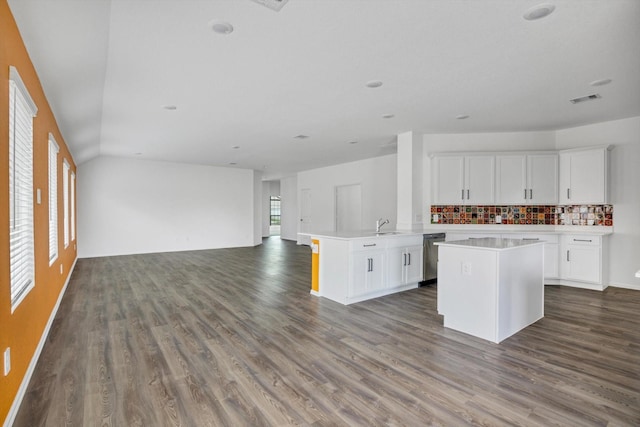 3148 Catalonion Ct, Conroe, TX 77301 - kitchen featuring dishwasher, open floor plan, dark wood finished floors, and white cabinets