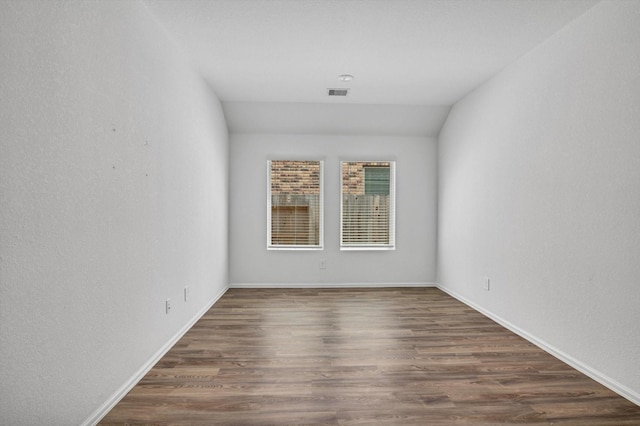 3148 Catalonion Ct, Conroe, TX 77301 - spare room with dark wood-style floors and baseboards