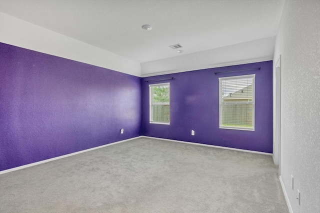 3148 Catalonion Ct, Conroe, TX 77301 - spare room with a textured wall, carpet, and baseboards
