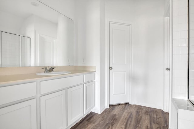 3148 Catalonion Ct, Conroe, TX 77301 - full bathroom featuring wood finished floors, vanity, and a shower