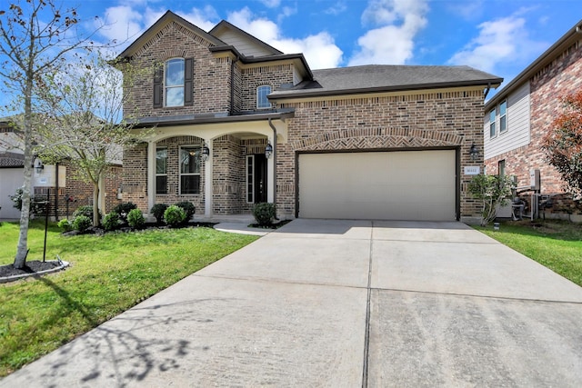 16111 Fairway Creek Cir, Crosby, TX 77532 - view of front of home with brick siding, a front yard, concrete driveway, covered porch, and a garage