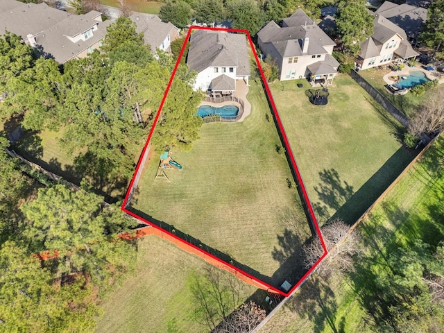 birds eye view of property with a residential view