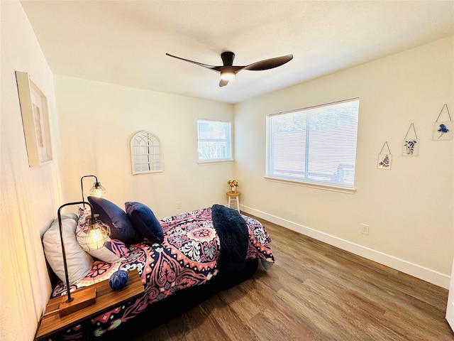 8522 Pearl Lake Dr, Houston, TX 77095 - bedroom with wood finished floors, baseboards, and a ceiling fan