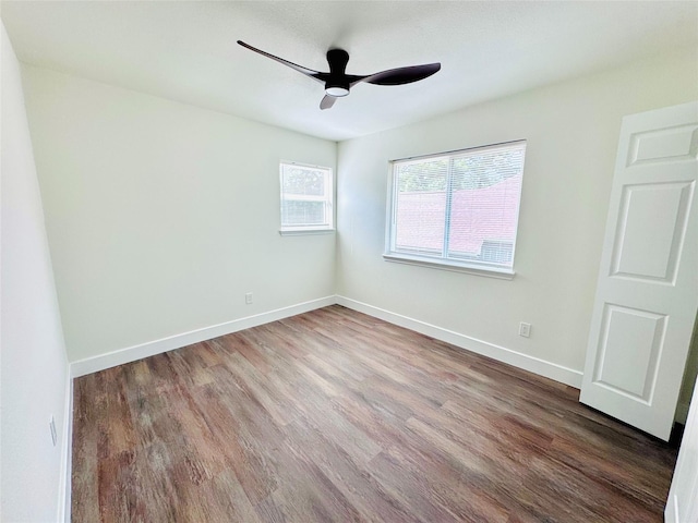 8522 Pearl Lake Dr, Houston, TX 77095 - empty room featuring a ceiling fan, wood finished floors, and baseboards