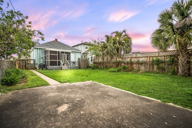 3529 Avenue S, Galveston, TX 77550 - view of yard with cooling unit, a fenced backyard, and a sunroom