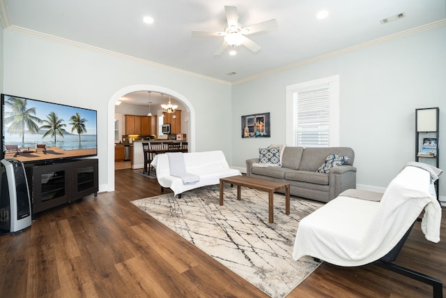 3529 Avenue S, Galveston, TX 77550 - living area featuring dark wood-style flooring, visible vents, baseboards, ornamental molding, and arched walkways
