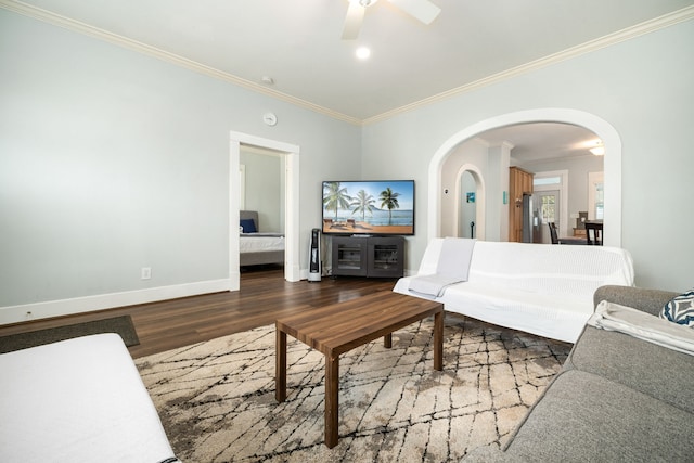 3529 Avenue S, Galveston, TX 77550 - living area with ornamental molding, baseboards, arched walkways, ceiling fan, and wood finished floors