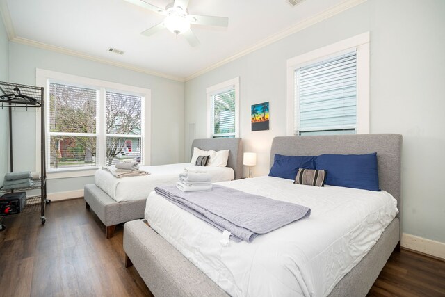 3529 Avenue S, Galveston, TX 77550 - bedroom with baseboards, crown molding, and dark wood-style flooring