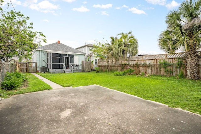 3529 Avenue S, Galveston, TX 77550 - view of yard featuring cooling unit, a sunroom, and a fenced backyard