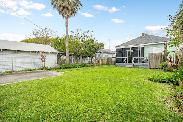 3529 Avenue S, Galveston, TX 77550 - view of yard featuring a sunroom and fence