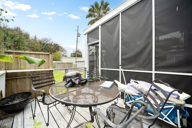 3529 Avenue S, Galveston, TX 77550 - deck with area for grilling, outdoor dining space, a sunroom, and fence