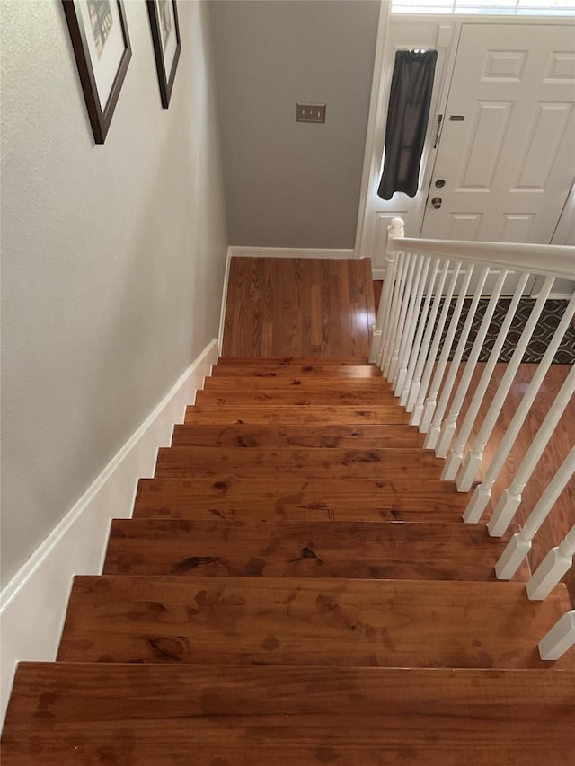 18146 River Sage Dr, Houston, TX 77084 - stairway with wood finished floors and baseboards
