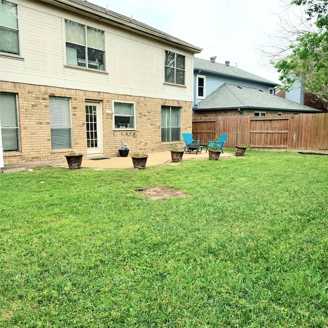 18146 River Sage Dr, Houston, TX 77084 - back of house featuring brick siding and a patio area