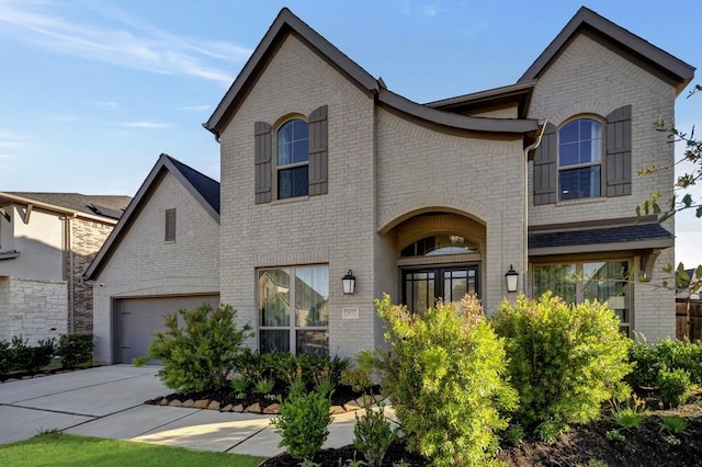 28902 Ridge Valley Ct, Fulshear, TX 77441 - french provincial home with brick siding, driveway, and a garage