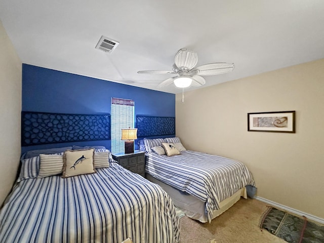 carpeted bedroom with baseboards, visible vents, and ceiling fan