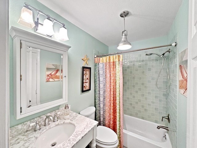 full bathroom with shower / tub combo with curtain, a textured ceiling, toilet, and vanity