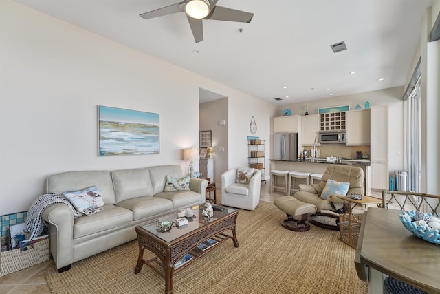 living room with radiator, visible vents, recessed lighting, and a ceiling fan
