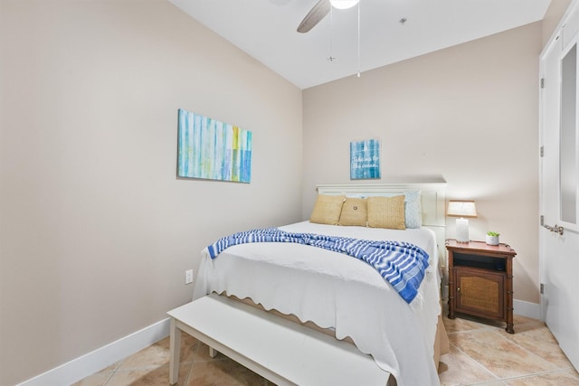 bedroom featuring baseboards, tile patterned floors, and a ceiling fan