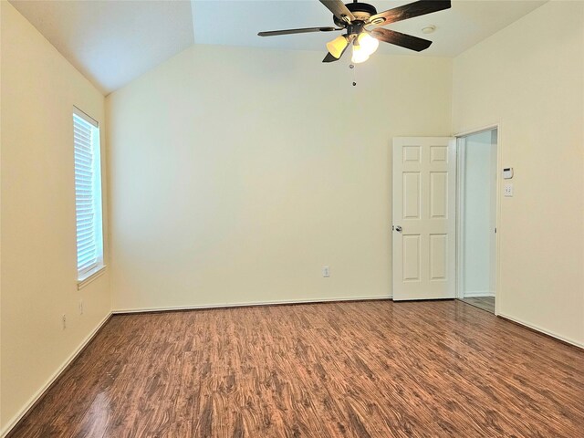 empty room featuring high vaulted ceiling, wood finished floors, a ceiling fan, and baseboards