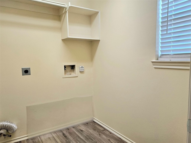 laundry area with laundry area, wood finished floors, hookup for an electric dryer, baseboards, and washer hookup
