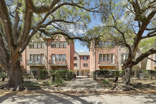 view of building exterior with fence