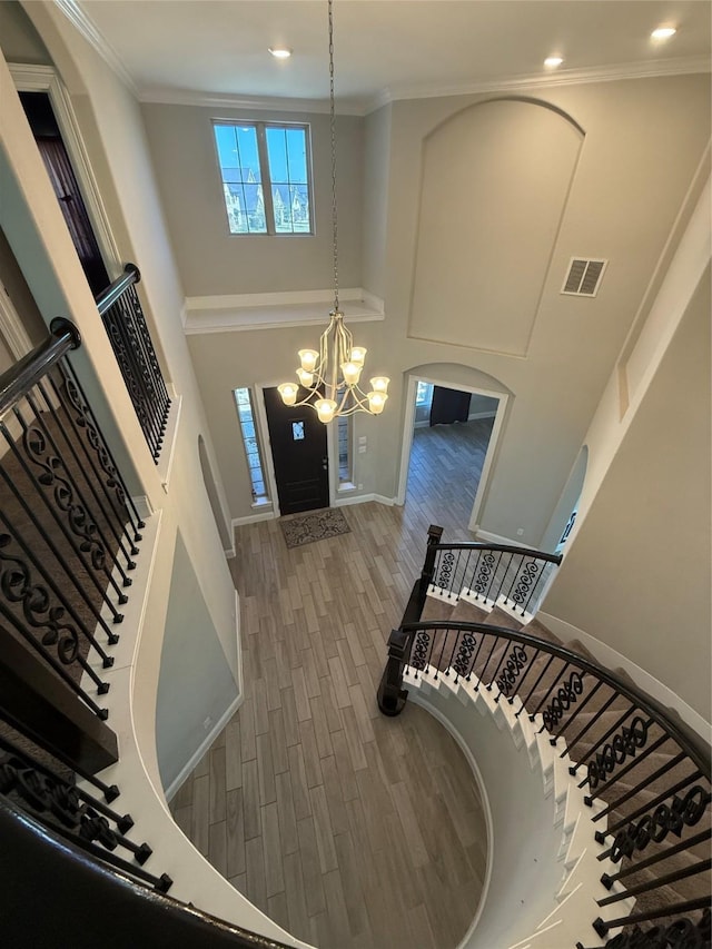 29431 Amber Meadows Ct, Katy, TX 77494 - entrance foyer featuring stairs, ornamental molding, a chandelier, visible vents, and wood finished floors