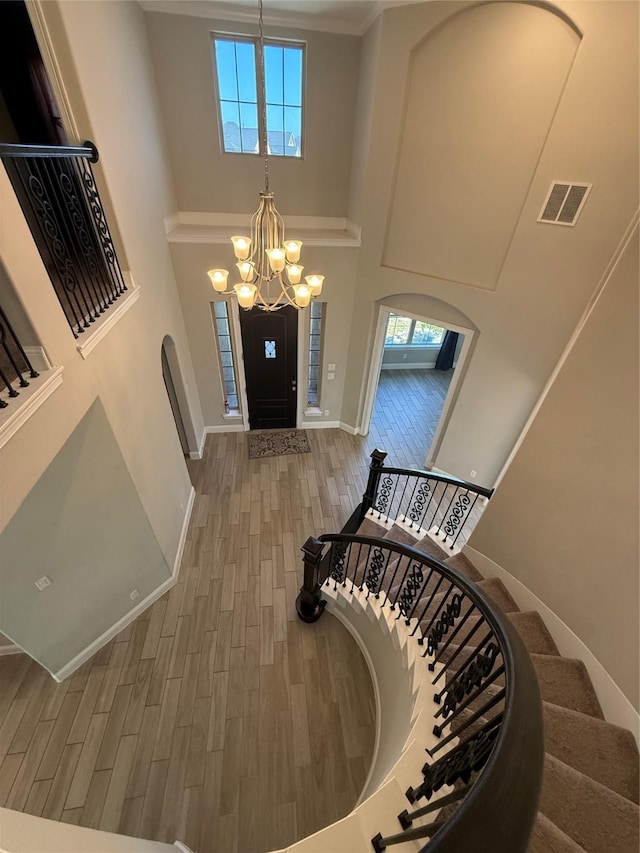 29431 Amber Meadows Ct, Katy, TX 77494 - entrance foyer with stairs, wood finished floors, visible vents, a towering ceiling, and an inviting chandelier