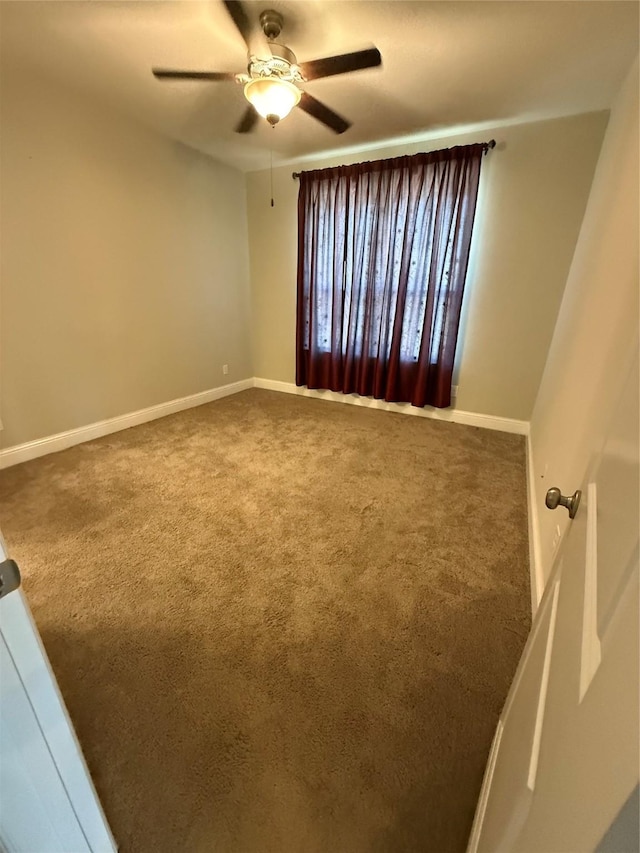 29431 Amber Meadows Ct, Katy, TX 77494 - spare room featuring baseboards, a ceiling fan, and carpet