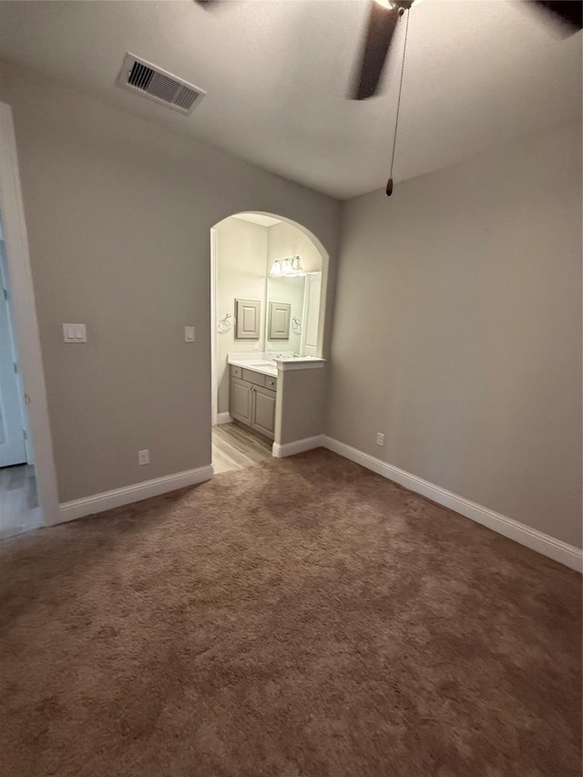 29431 Amber Meadows Ct, Katy, TX 77494 - carpeted empty room featuring arched walkways, baseboards, ceiling fan, and visible vents