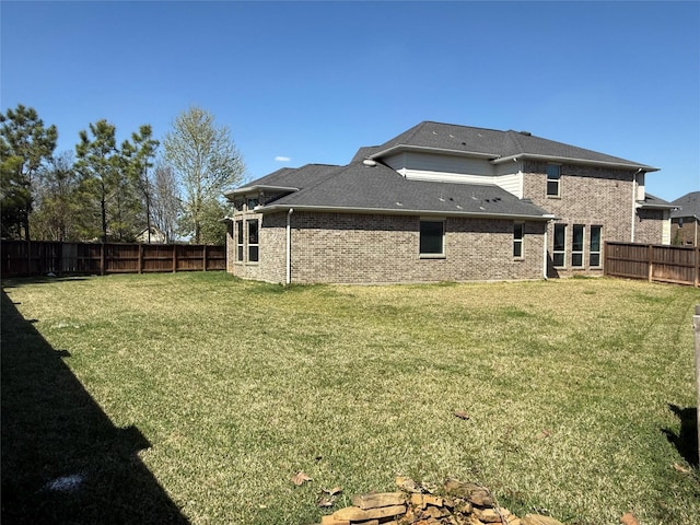 29431 Amber Meadows Ct, Katy, TX 77494 - back of property featuring brick siding, a fenced backyard, and a yard
