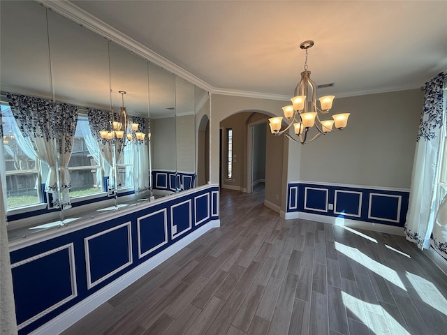 29431 Amber Meadows Ct, Katy, TX 77494 - kitchen with blue cabinetry, a decorative wall, arched walkways, and a chandelier
