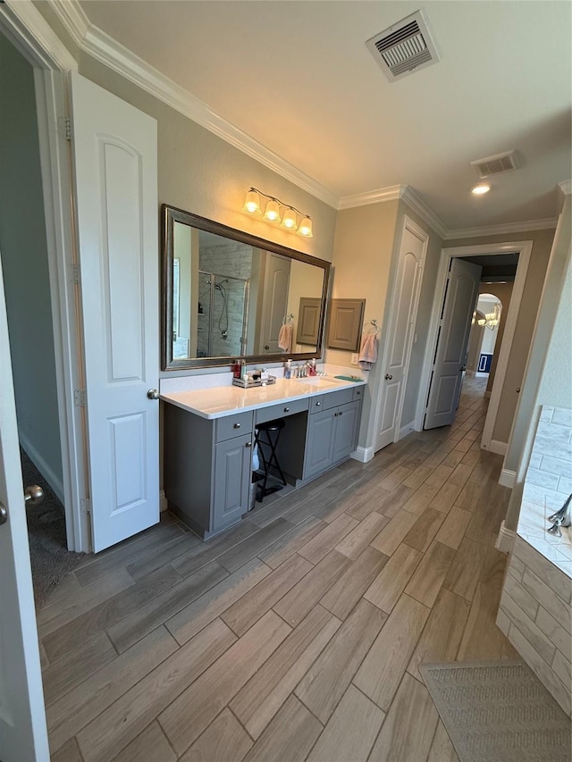29431 Amber Meadows Ct, Katy, TX 77494 - full bath with crown molding, a shower stall, wood finish floors, visible vents, and double vanity