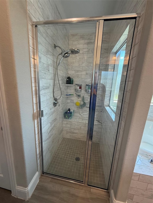29431 Amber Meadows Ct, Katy, TX 77494 - bathroom featuring a stall shower and wood finished floors