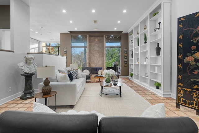 9171 Briar Frst, Houston, TX 77024 - tiled living area with recessed lighting, baseboards, and built in shelves