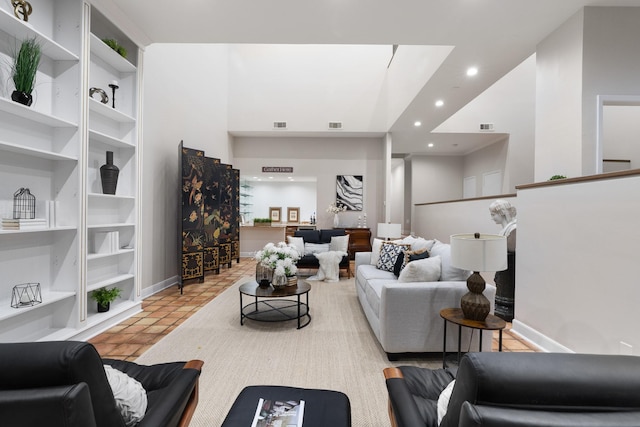 9171 Briar Frst, Houston, TX 77024 - tiled living room featuring recessed lighting, baseboards, and built in features