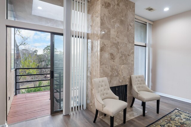 9171 Briar Frst, Houston, TX 77024 - sitting room featuring wood finished floors, baseboards, and recessed lighting