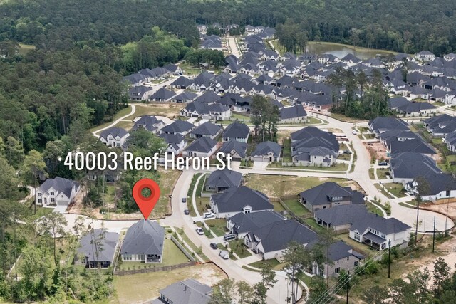 40003 Reef Heron St, Magnolia, TX 77354 - aerial overview of property's location featuring a forest and nearby suburban area