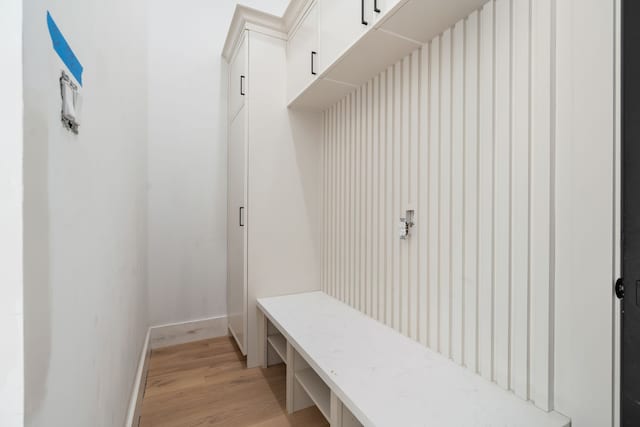 mudroom with baseboards and light wood-type flooring