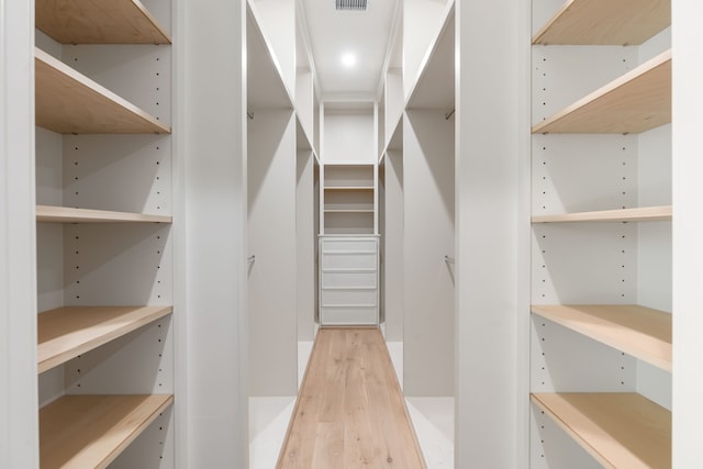 walk in closet featuring visible vents and light wood-style flooring