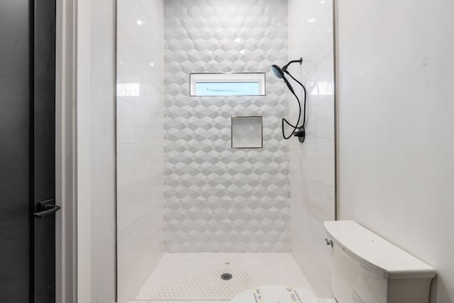 full bathroom with tiled shower