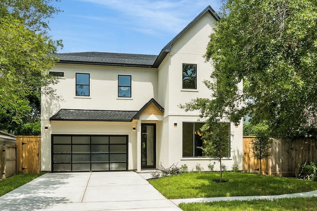 6536 Community Dr, West University Place, TX 77005 - view of front facade featuring a shingled roof, driveway, stucco siding, and an attached garage