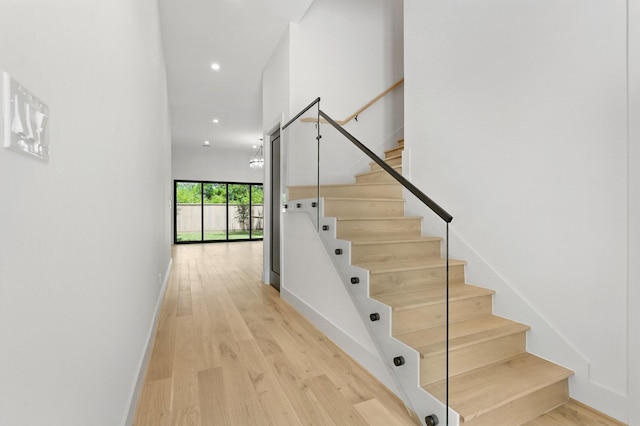 6536 Community Dr, West University Place, TX 77005 - stairs featuring wood finished floors and recessed lighting