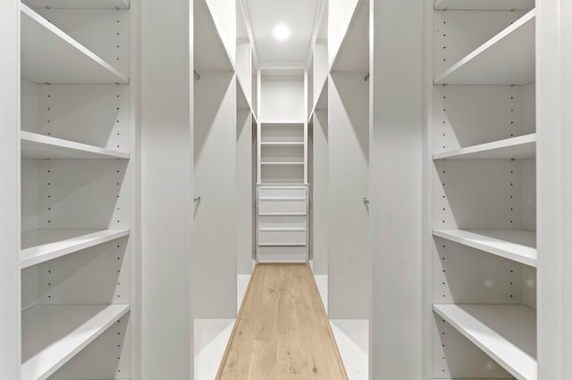 6536 Community Dr, West University Place, TX 77005 - walk in closet featuring light wood-style flooring