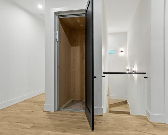 6536 Community Dr, West University Place, TX 77005 - corridor with light wood-type flooring and baseboards