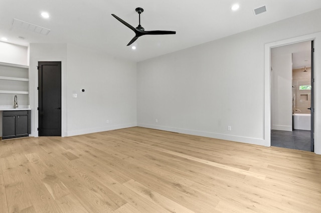 6536 Community Dr, West University Place, TX 77005 - unfurnished living room featuring ceiling fan, light wood-style flooring, built in features, and recessed lighting