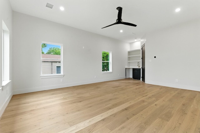 6536 Community Dr, West University Place, TX 77005 - unfurnished living room featuring light wood-style flooring, ceiling fan, and recessed lighting