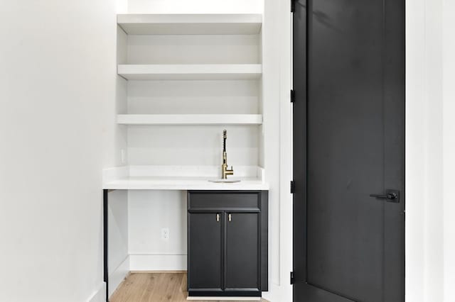 6536 Community Dr, West University Place, TX 77005 - indoor bar featuring light wood-type flooring and baseboards